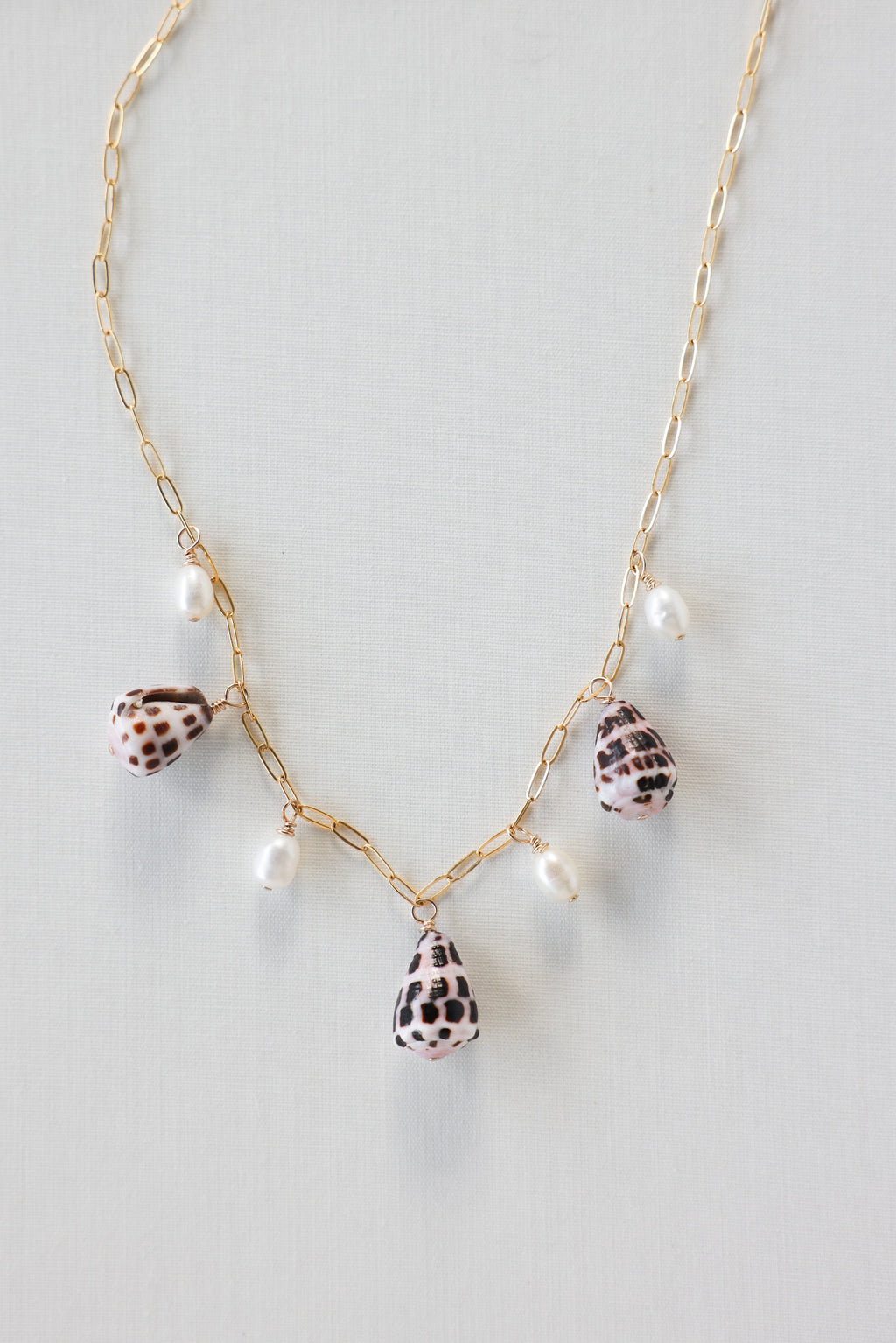 Cone shell charm necklace