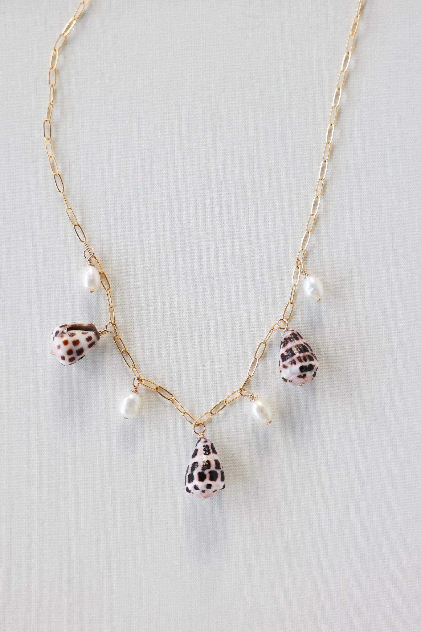Cone shell charm necklace