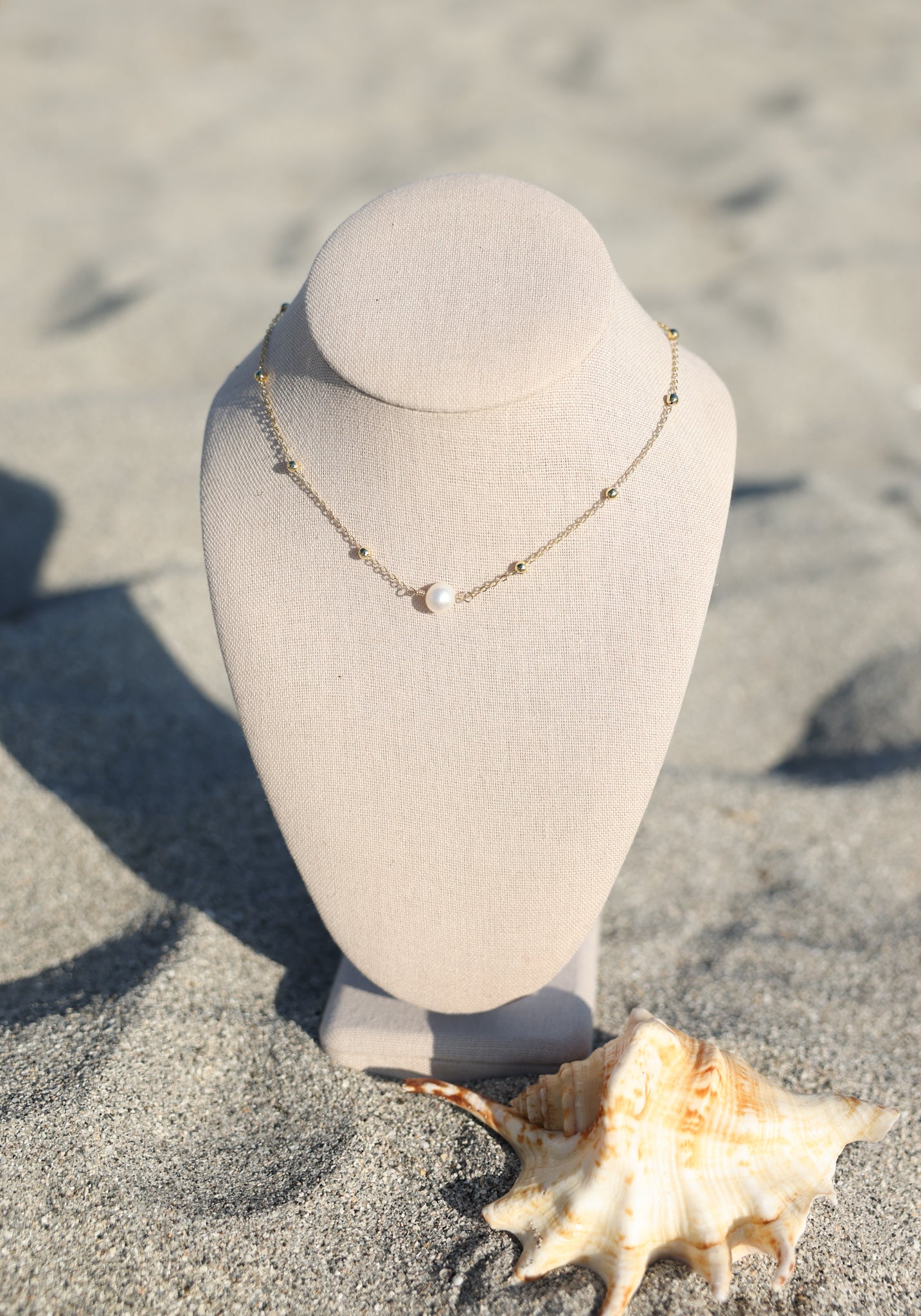 The pearl necklace